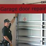 Garage Door Specialist standing at a grage door