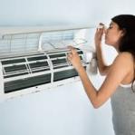 Electrical Services A Woman observing into an AC