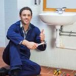 Plumbing System Plumber Posing at Wash Basin